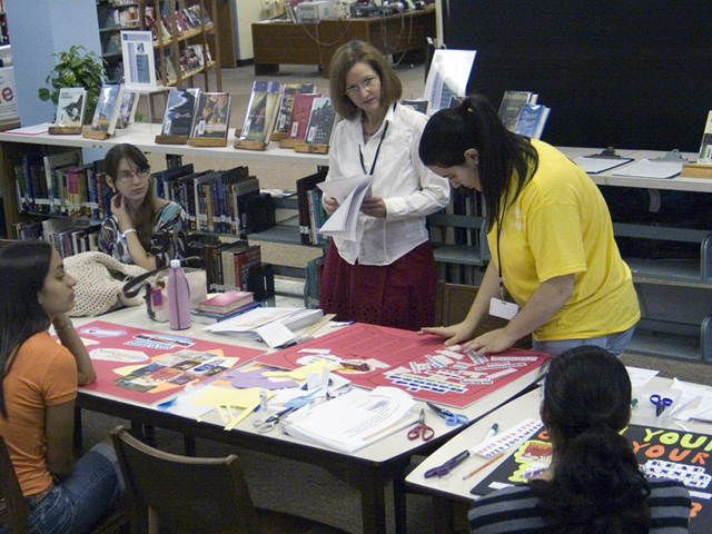 MAP intern Rosa Fiol shows Ms. Stafford her banned books poster. (2007)