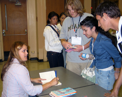 author Gaby Triana takes time to autograph copies for students (2007)